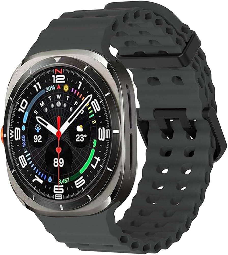 Black silicone sport band worn on Samsung Galaxy Watch Ultra 47mm with white face, breathable perforated design